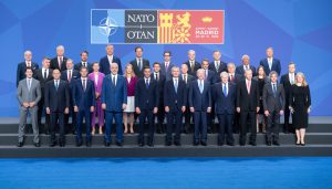 Head of states and government representatives standing for a group photo at the 2022 NATO summit in Madrid