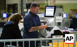 AP Image of people at voting machines