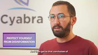 Bearded man with glasses discussing ways to protect yourself from disinformation, purple text overlay and blurred Cyabra logo in background