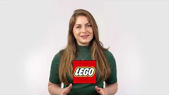 Smiling woman in green top gesturing with hands, LEGO logo centered on her torso against a light gray background