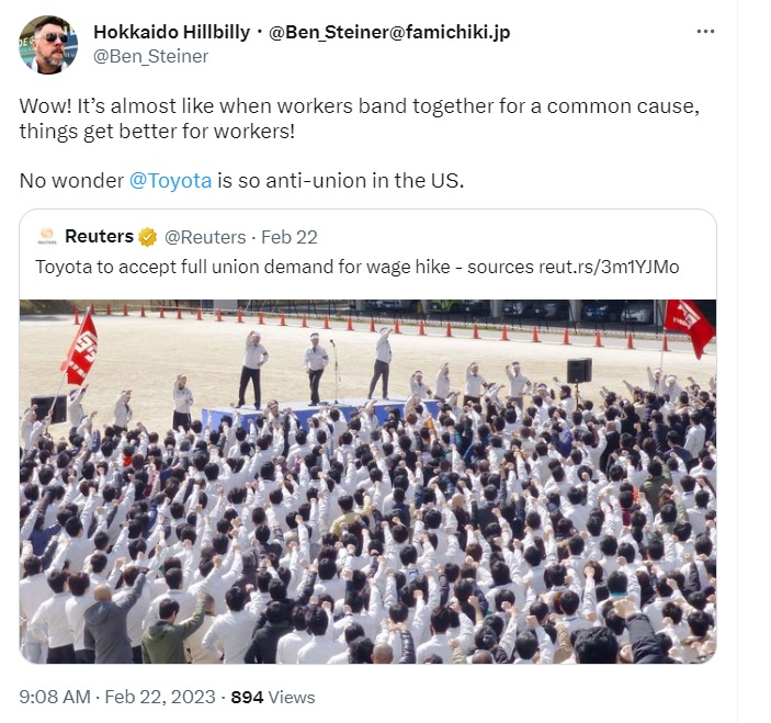 Tweet praising worker solidarity and criticizing Toyota’s anti-union stance, with an embedded Reuters link about Toyota accepting a union wage-hike demand, alongside a photo of a large crowd of Toyota workers in white uniforms raising their fists near a small stage