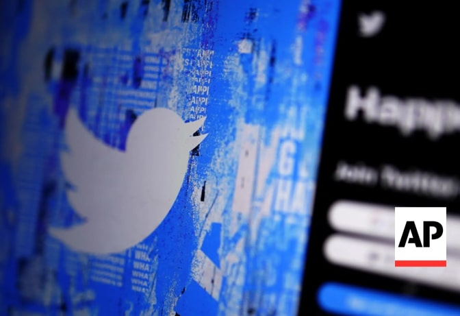 Twitter logo on a textured blue background beside a blurred login screen