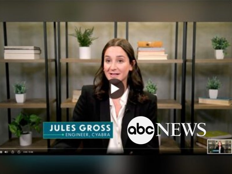 Jules Gross, an engineer at Cyabra, speaking during an ABC News video interview with shelves of books and plants in the background