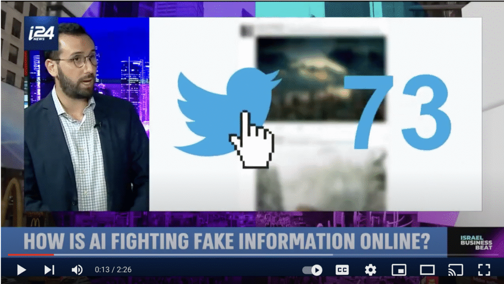i24 News broadcast featuring a guest speaker and on-screen graphic of the Twitter logo with a cursor and the number 73, illustrating AI efforts to combat online disinformation