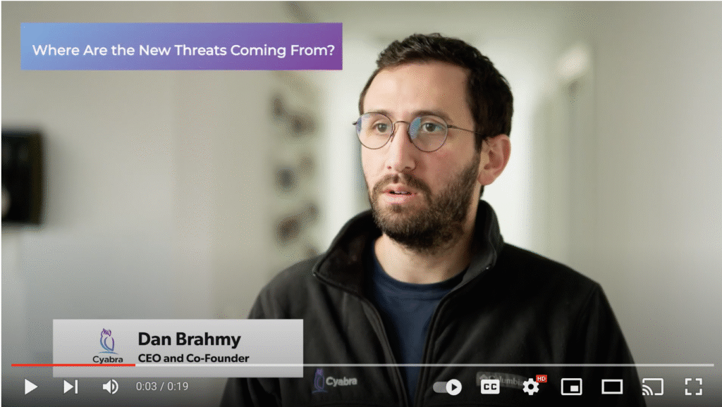 Video frame of a man in glasses speaking; purple banner reads “Where Are the New Threats Coming From?” and a lower-third caption beside the Cyabra logo states “Dan Brahmy, CEO and Co-Founder”