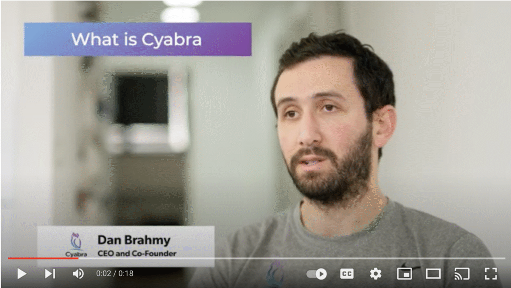 Man with short dark hair and beard speaking in a video interview; banner reads 'What is Cyabra' and lower third identifies him as CEO and co-founder
