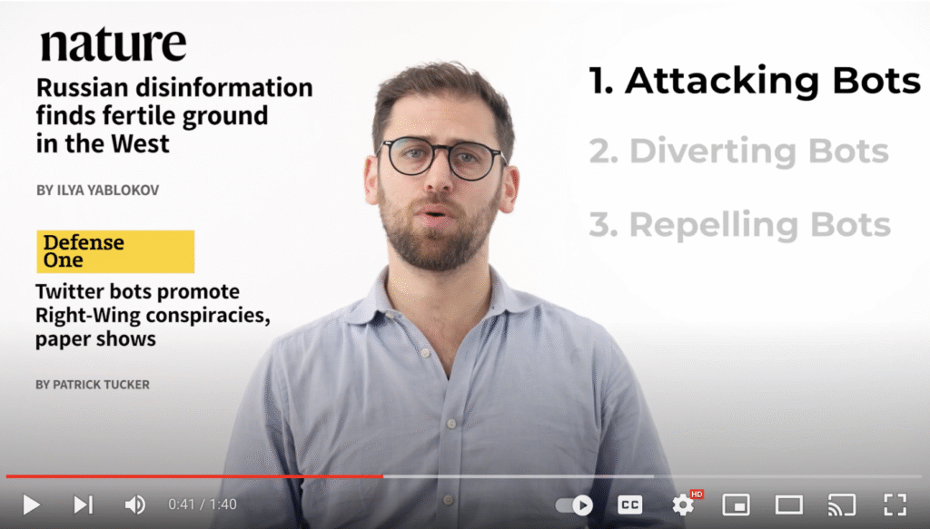 Man in glasses presenting next to headlines on Russian disinformation and Twitter bots, with a list showing strategy 1: Attacking Bots highlighted