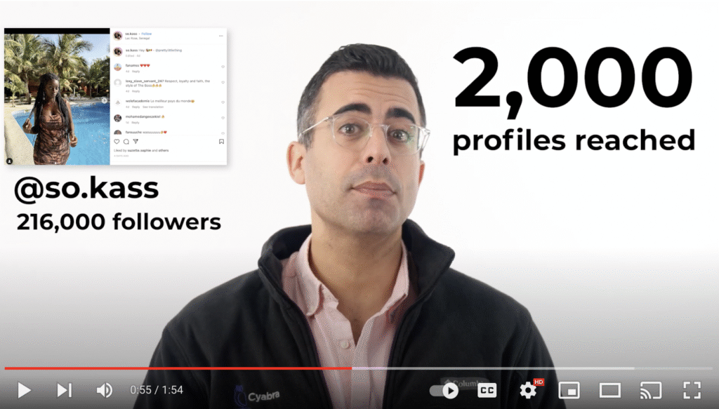 Presenter in a video explains social media metrics with on-screen text showing Instagram account @so.kass with 216,000 followers and statistic of 2,000 profiles reached