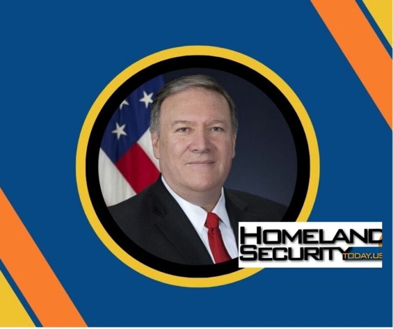 Official portrait of a man in suit and red tie set in a circular frame against a blue background with orange and yellow accents and the Homeland Security Today logo