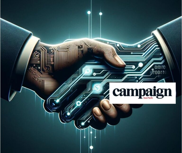 Illustration of a human hand shaking a circuit-board robotic hand, representing Golin and Cyabra collaborating against disinformation; Campaign Asia-Pacific logo overlays the image
