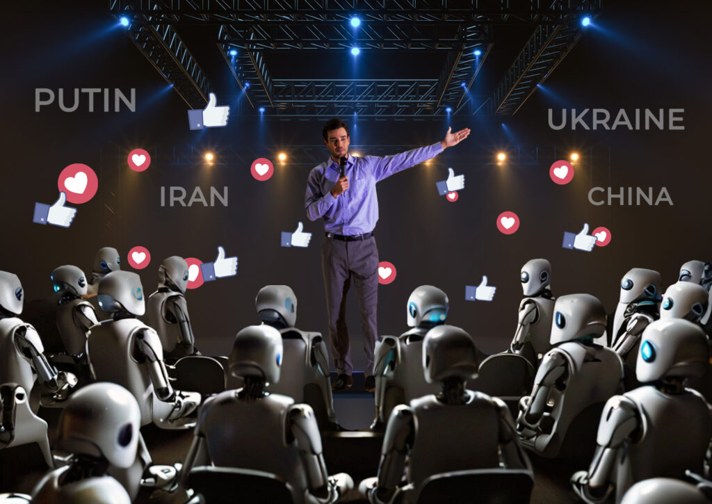 Man speaking on stage to an audience of humanoid robots, with floating social-media like and heart icons and the words Putin, Ukraine, Iran, China in the background, symbolizing bot networks amplifying controversial topics