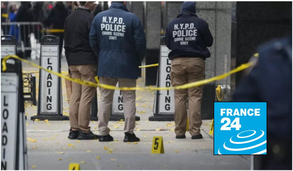NYPD Crime Scene Unit officers standing behind yellow police tape on a city sidewalk, with evidence markers on the ground