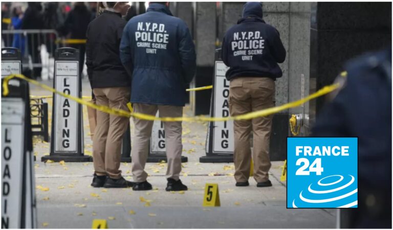 NYPD Crime Scene Unit officers standing behind yellow police tape on a city sidewalk, with evidence markers on the ground