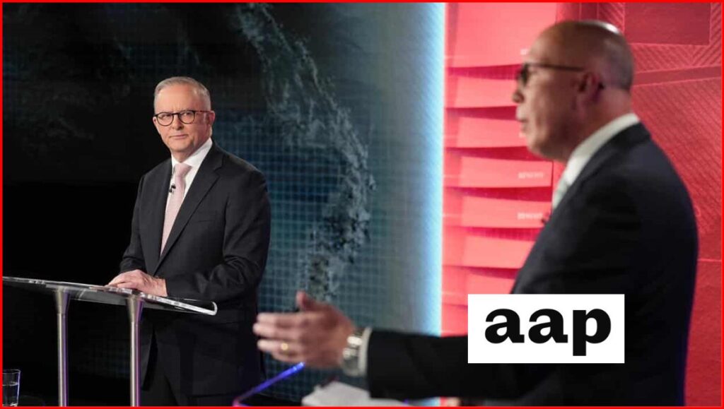 Two suited political candidates at podiums during a televised election debate, with a digital world map backdrop and red studio panels
