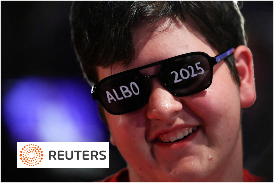 Smiling supporter wearing sunglasses with ALBO 2025 written on the lenses at an Australian election event