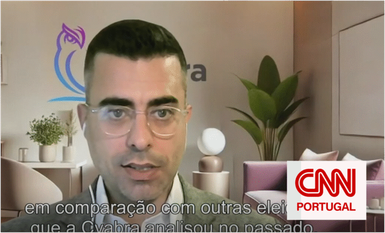Cyabra analyst speaking in a CNN Portugal video call about fake social-media accounts, with company logo and Portuguese subtitles on screen