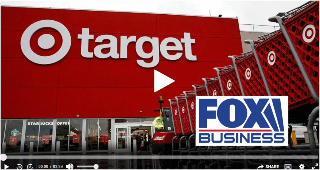 Target storefront featuring large logo and a row of red shopping carts, with Fox Business video overlay