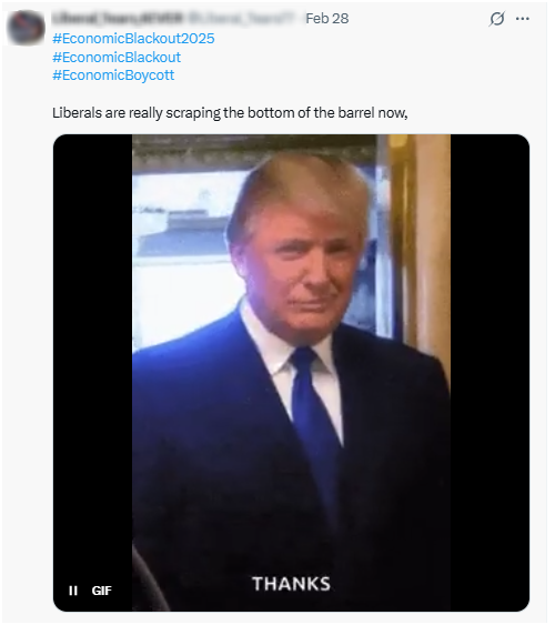 A man in a dark suit and tie standing indoors with a slight smile and the caption 'THANKS' at the bottom