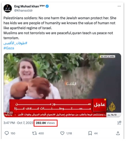 Twitter post asserting Palestinian soldiers protected a Jewish woman, featuring an embedded Al Jazeera video frame where a woman hugs a child, red breaking-news banner in Arabic, and a view count highlighted below